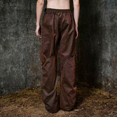 ILNya Nieternite Nifutur Weathered Coated Deconstructed Trousers