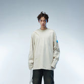 WHISTLEHUNTER Asymmetric Cut Logo Patched L/S Tee