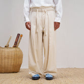 UNLIMITED MOTE Pleated Herringbone Wide-Leg Trousers