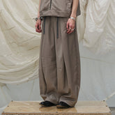 RELABEL Pleated Drawstring Curved Wide-Leg Trousers