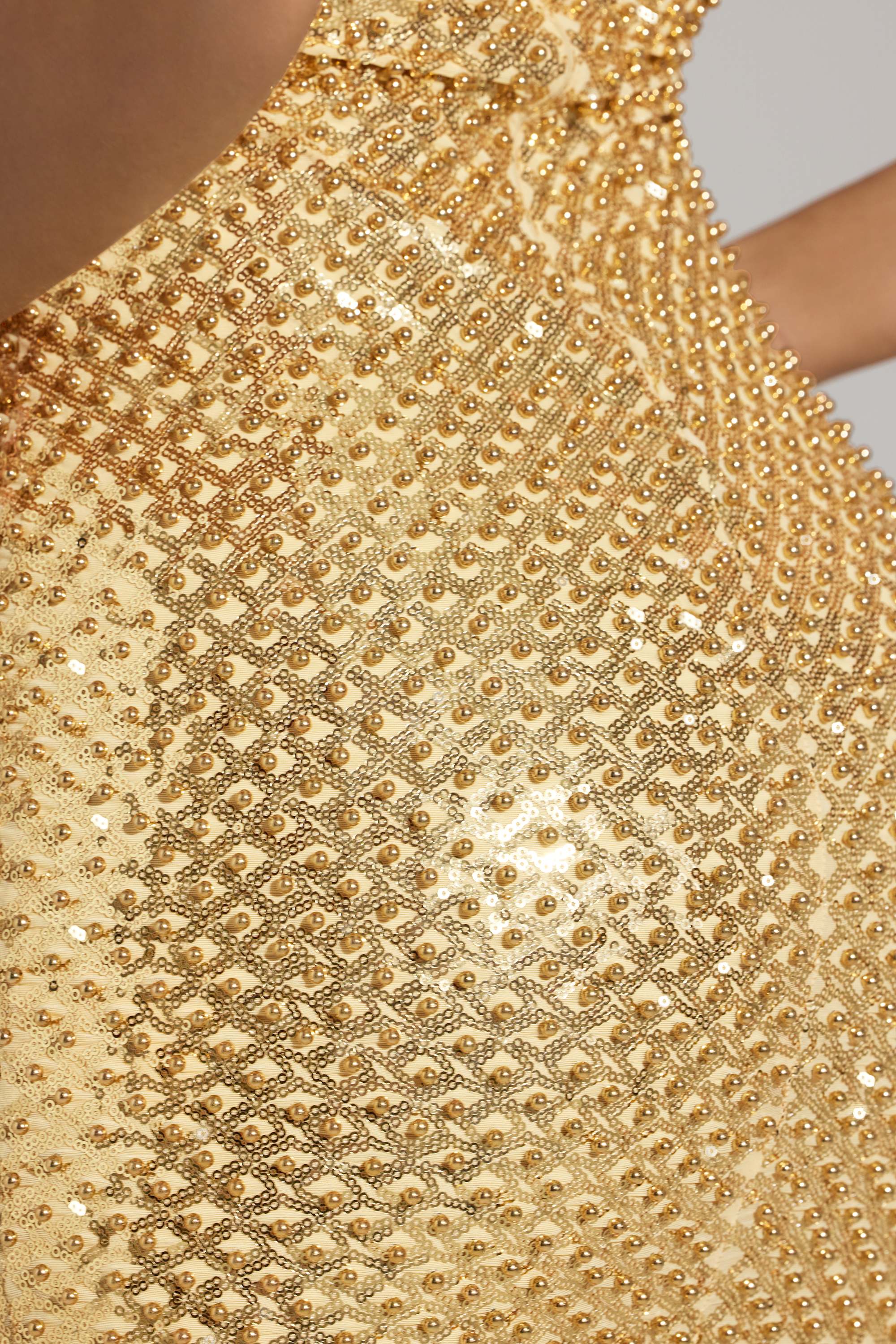 Oh Polly model Sofia wearing the Drop A Glint Mini Dress in Gold Embellished fabric perfect for clubbing nights