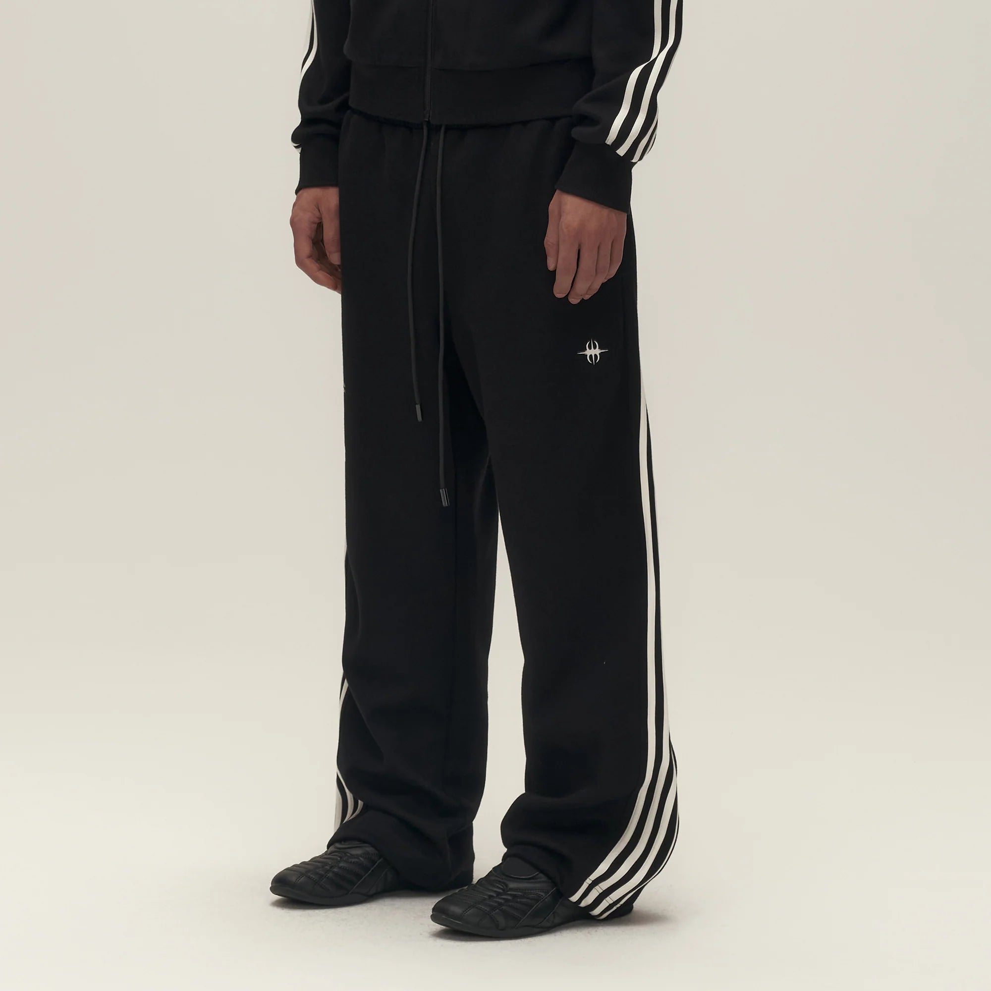 SAVAGEGROWTHWORLD Back-Arc Striped Graphic Track Pants