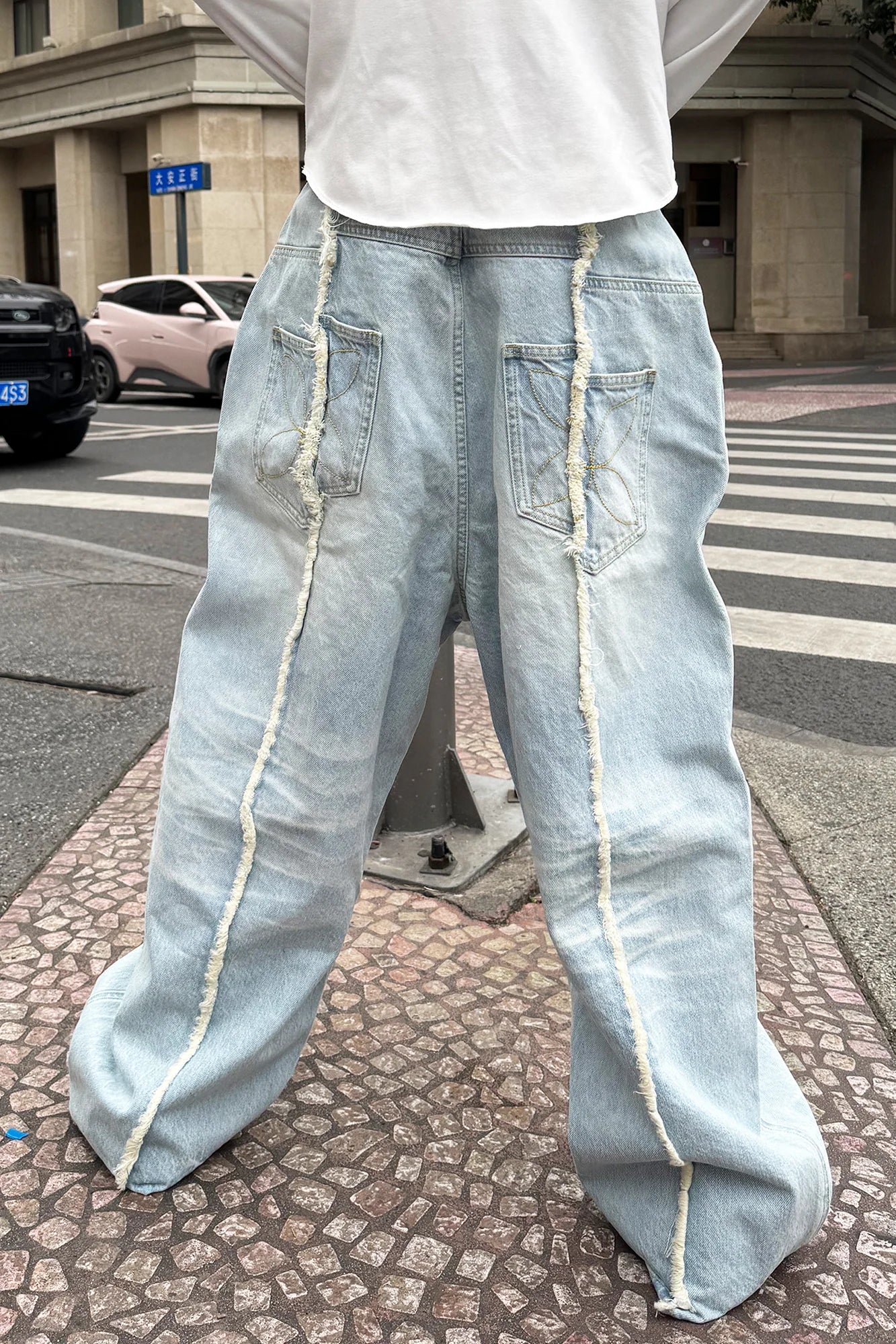STEEPC Washed Frayed Seam Baggy Jeans