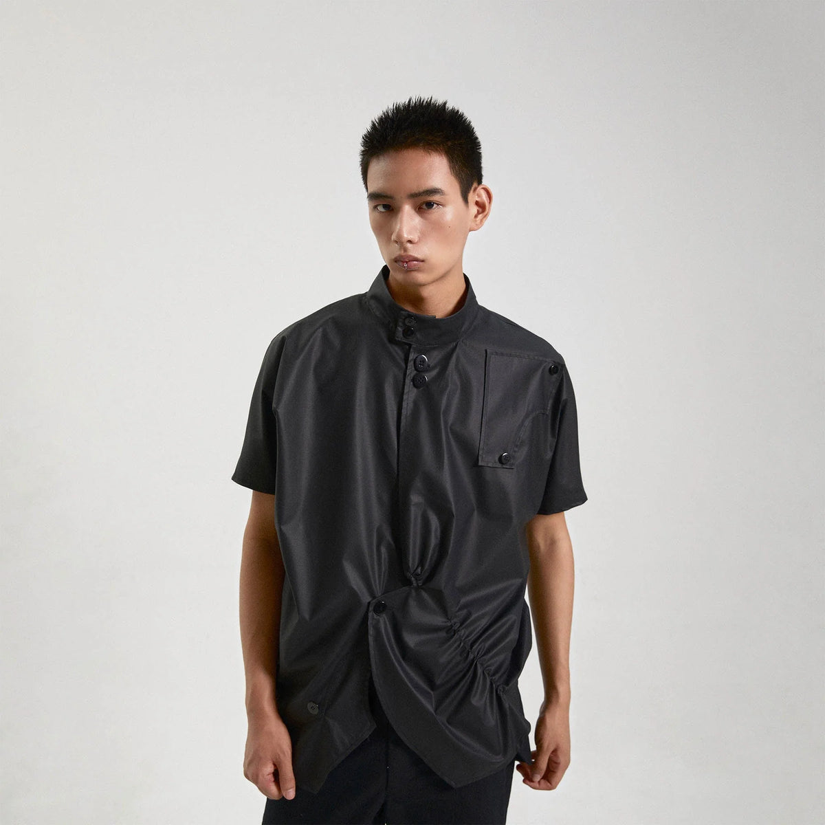 KADAKADA Asymmetrical Pleated Faux Leather Half Shirt