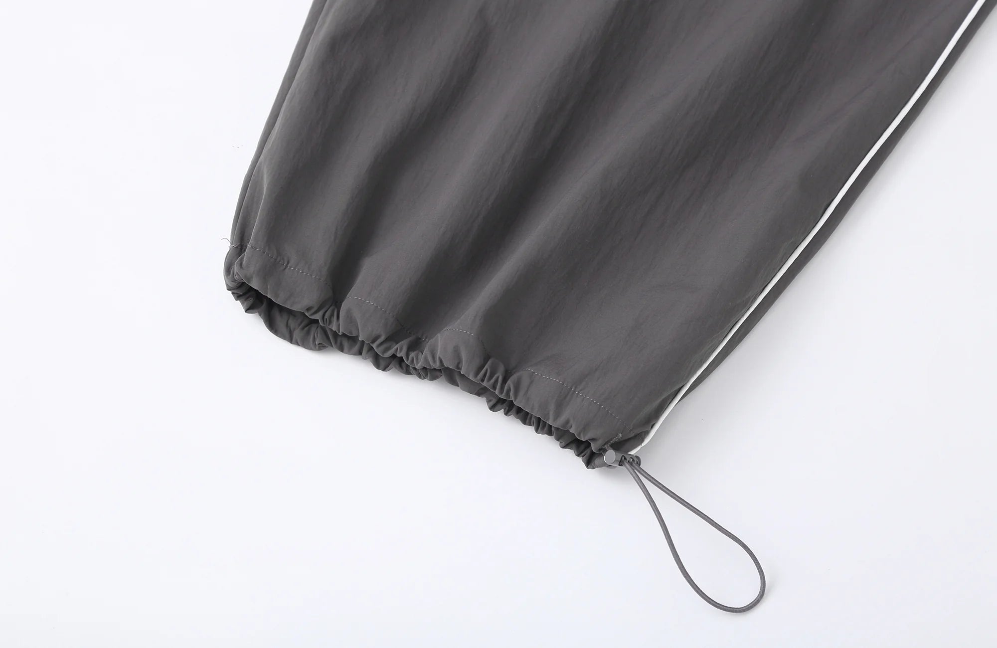 CLP Contrast Panel Pleated-Knee Drawstring-Hem Pants