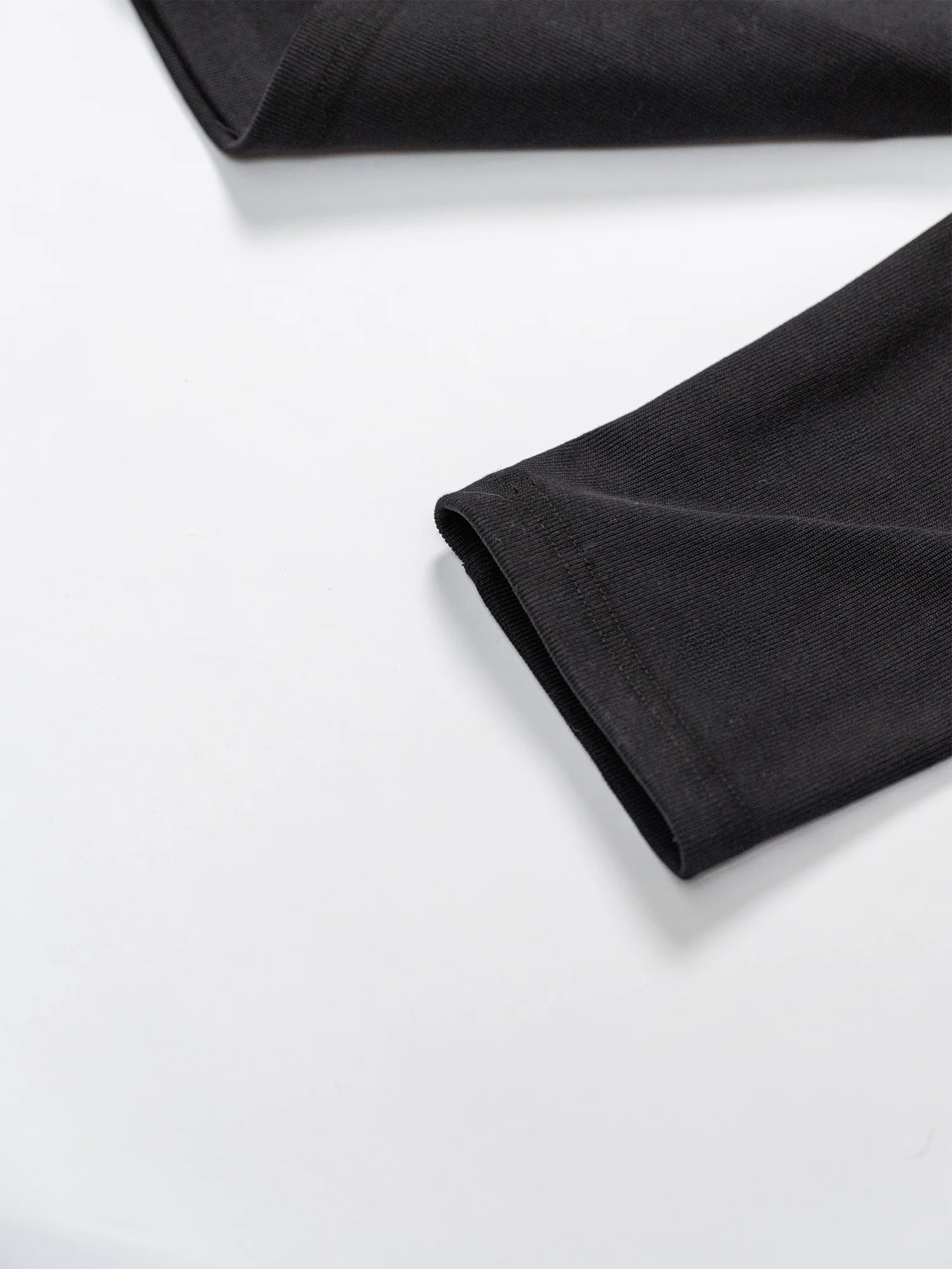 KADAKADA Buttoned Curved Placket Ribbed Knit Top