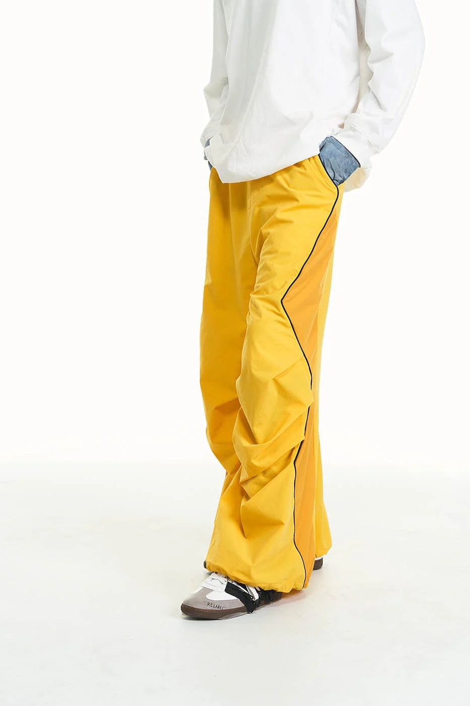 RELABEL Zig-Zag Spliced Pleated Parachute Pants