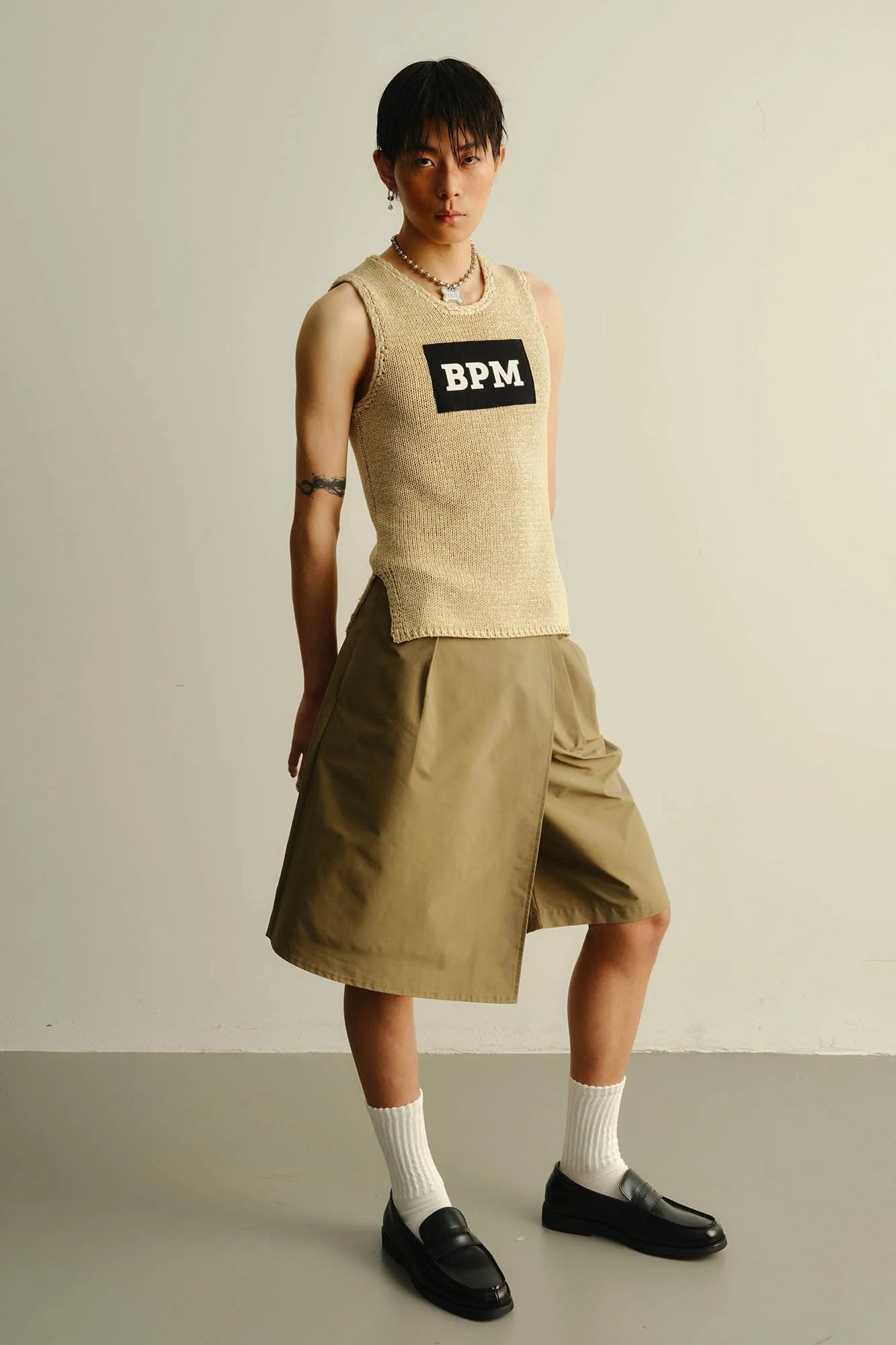 KADAKADA Asymmetrical Overlay Pleated Shorts