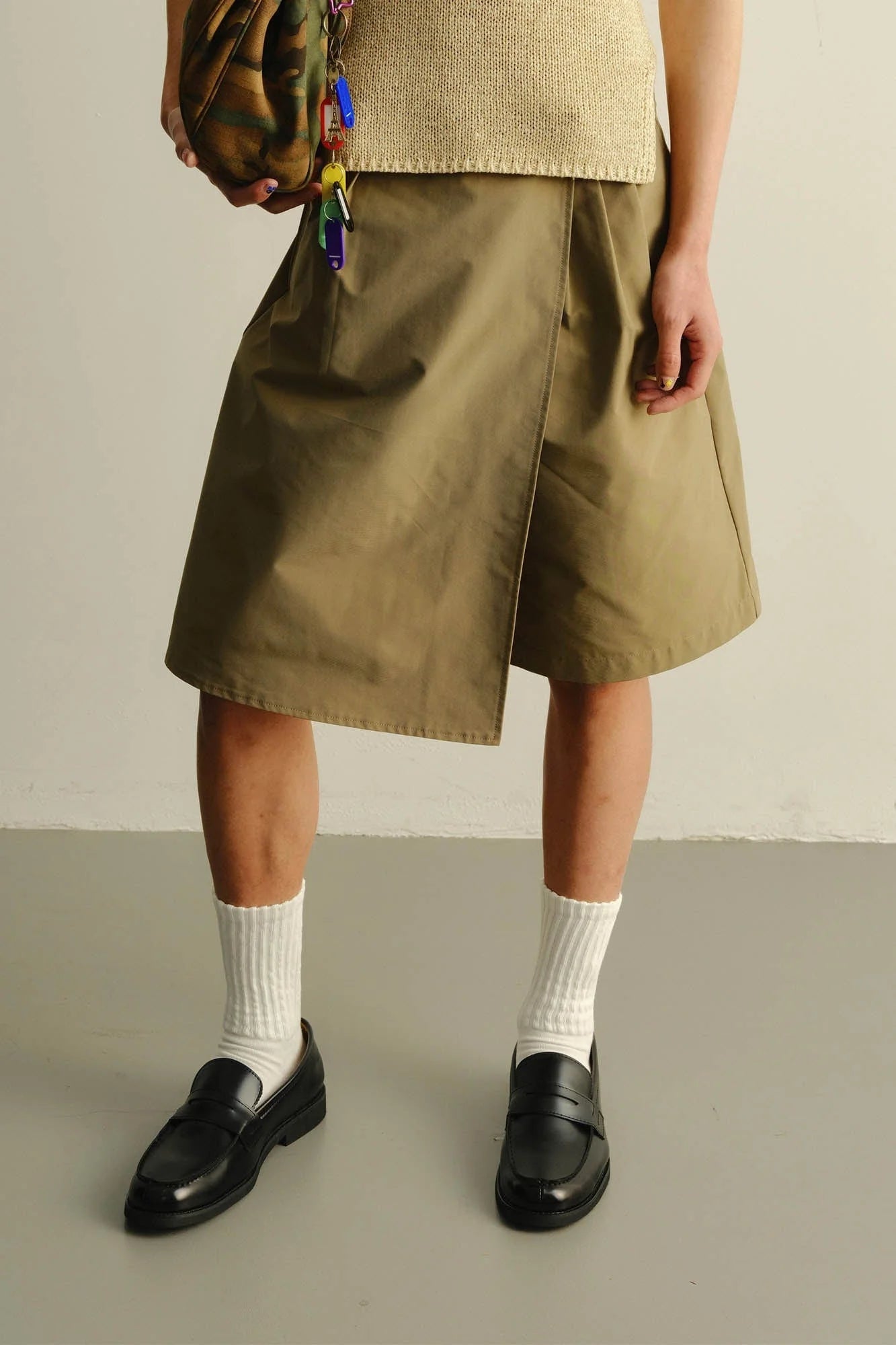 KADAKADA Asymmetrical Overlay Pleated Shorts