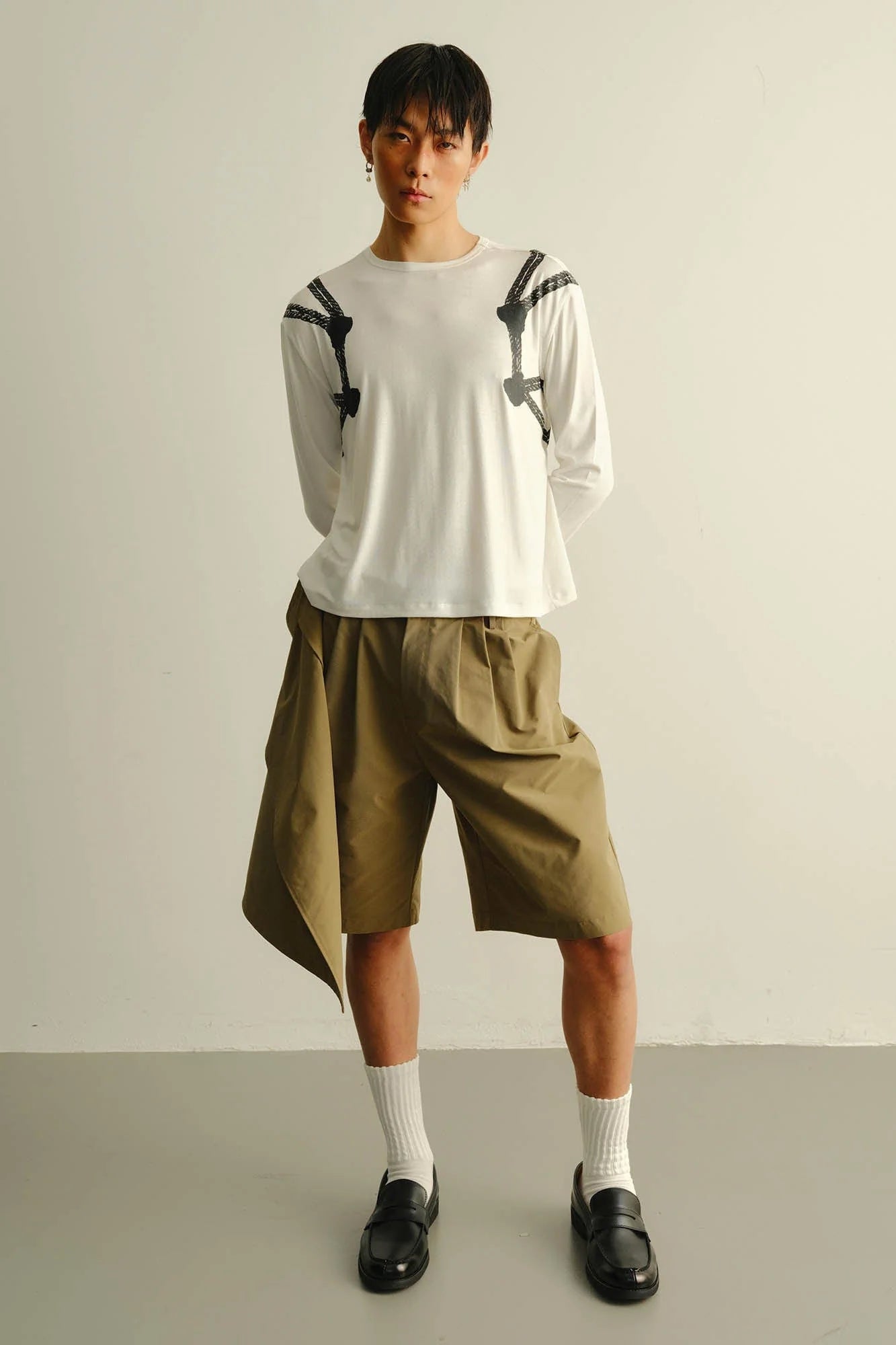 KADAKADA Asymmetrical Overlay Pleated Shorts