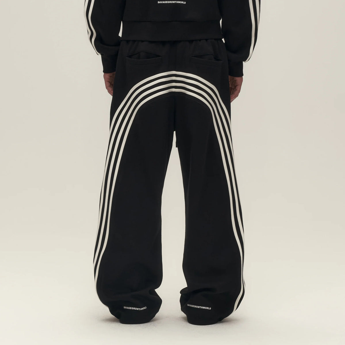 SAVAGEGROWTHWORLD Back-Arc Striped Graphic Track Pants