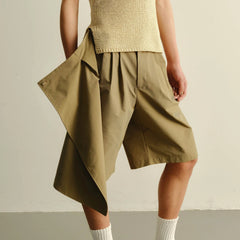 KADAKADA Asymmetrical Overlay Pleated Shorts