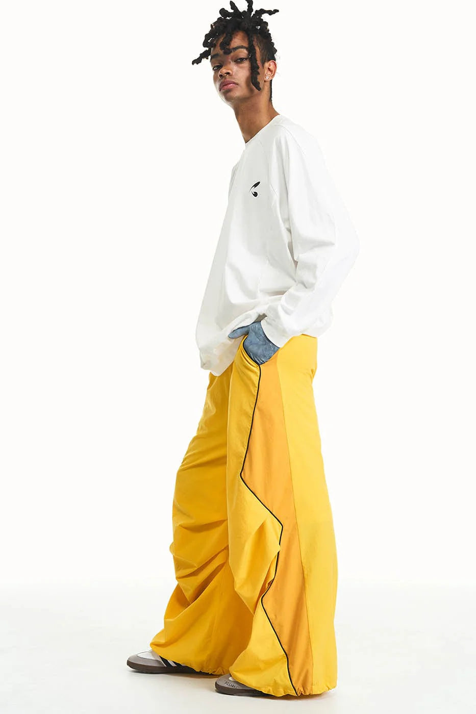 RELABEL Zig-Zag Spliced Pleated Parachute Pants
