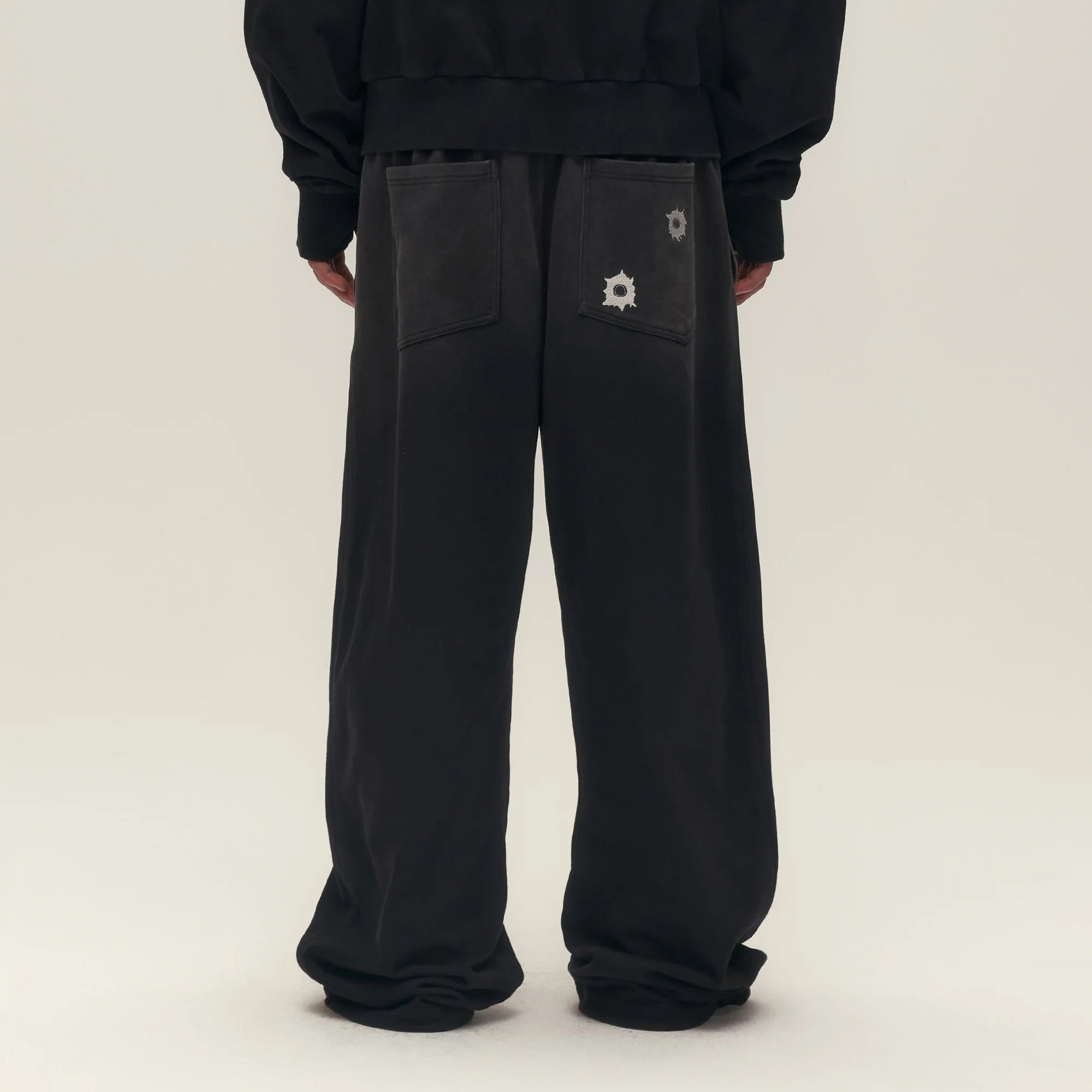 SAVAGEGROWTHWORLD Bullet Graphic Washed Wide-Leg Sweatpants