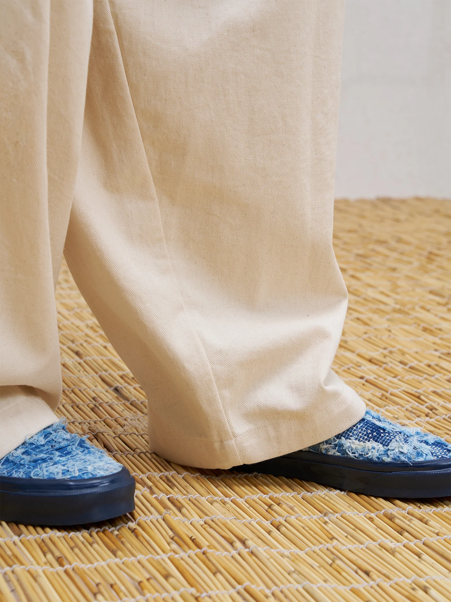 UNLIMITED MOTE Pleated Herringbone Wide-Leg Trousers