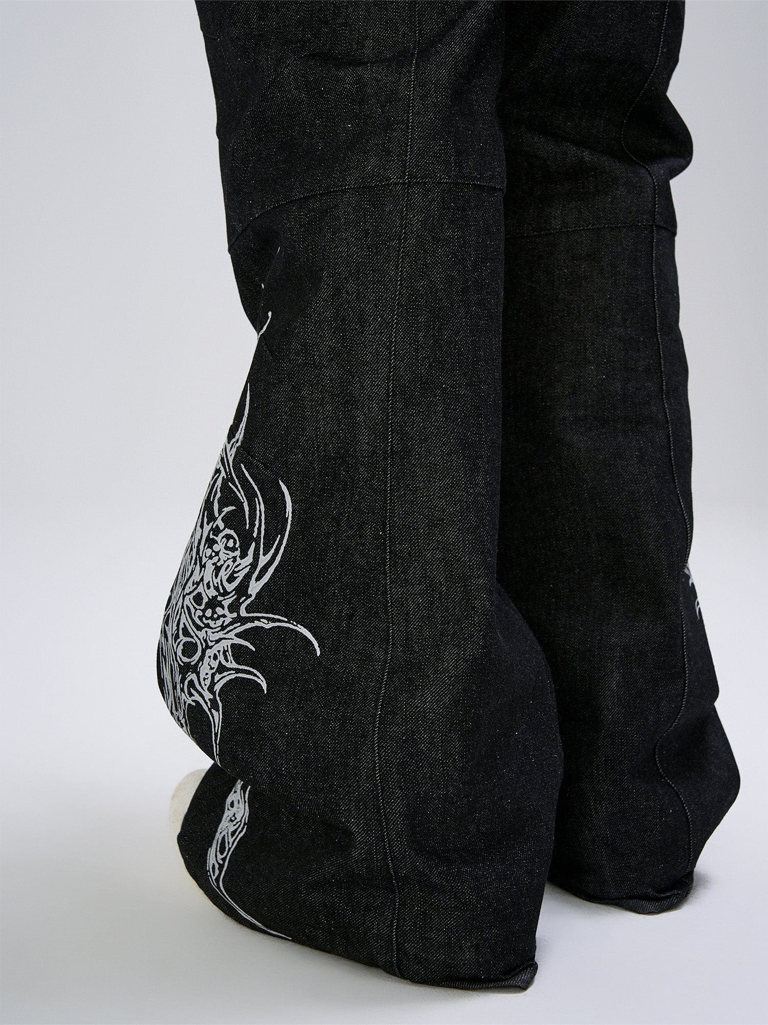 FLYERRER Abstract Graphic Flared Raw Jeans