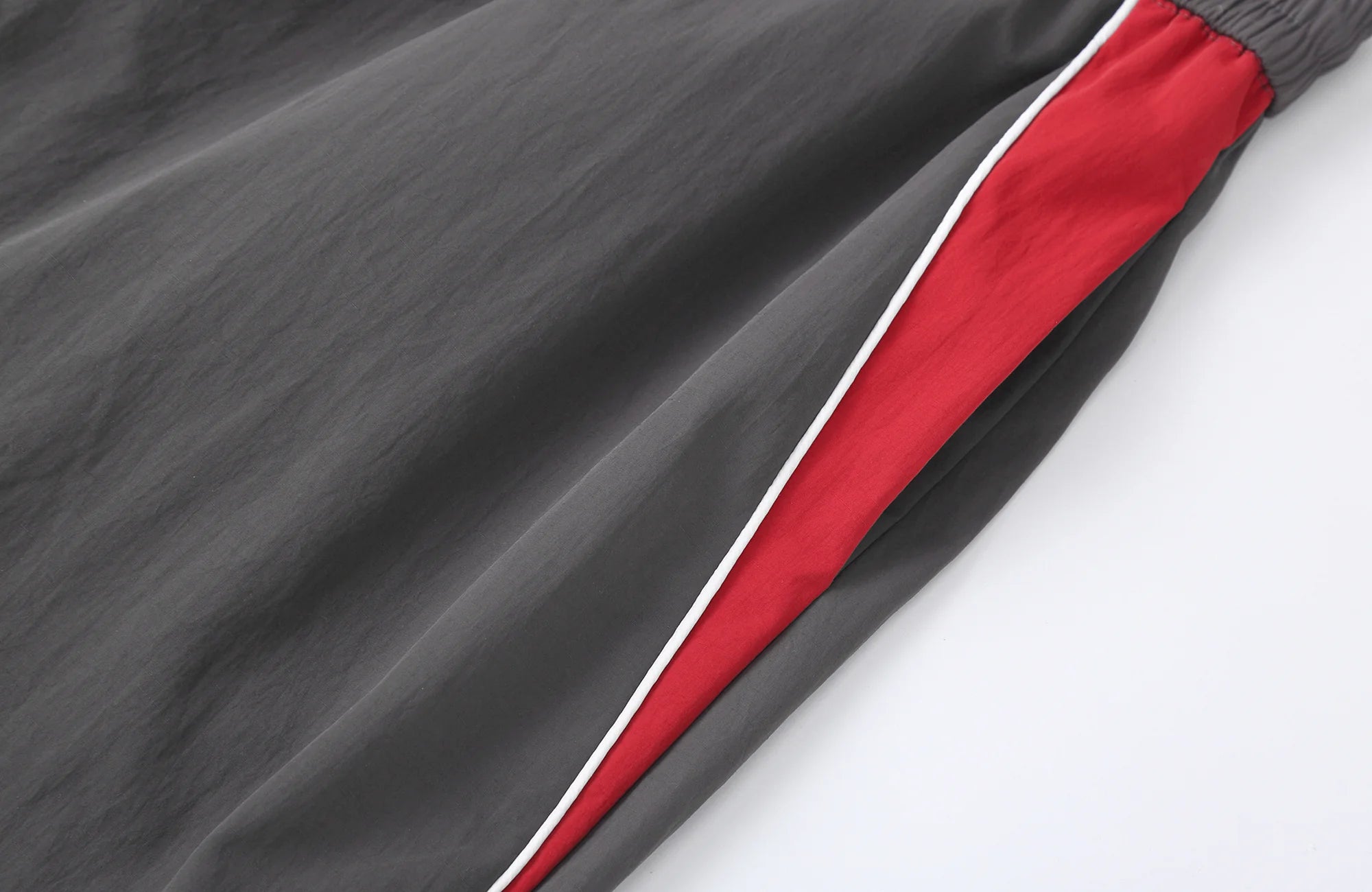CLP Contrast Panel Pleated-Knee Drawstring-Hem Pants