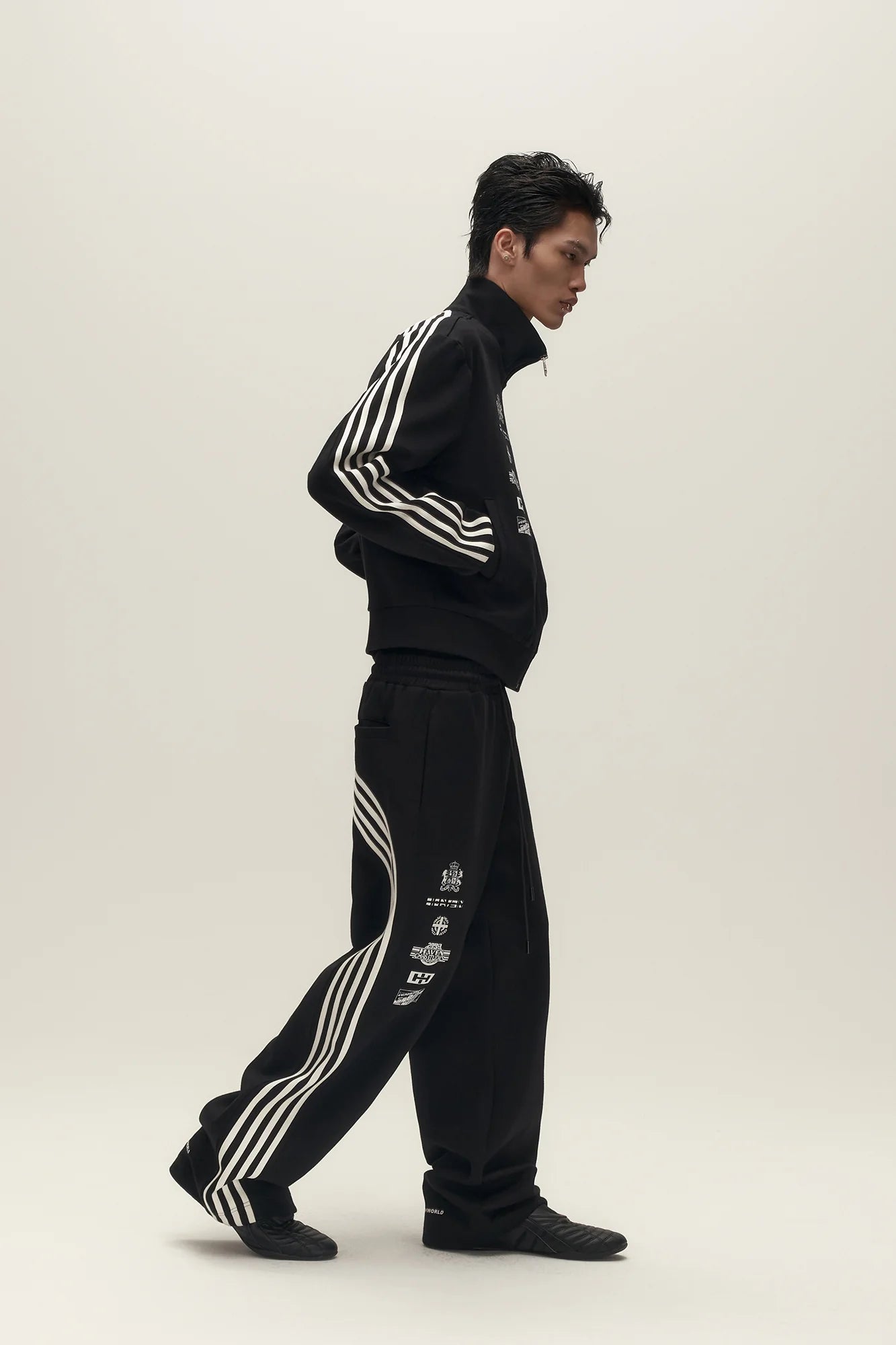 SAVAGEGROWTHWORLD Back-Arc Striped Graphic Track Pants
