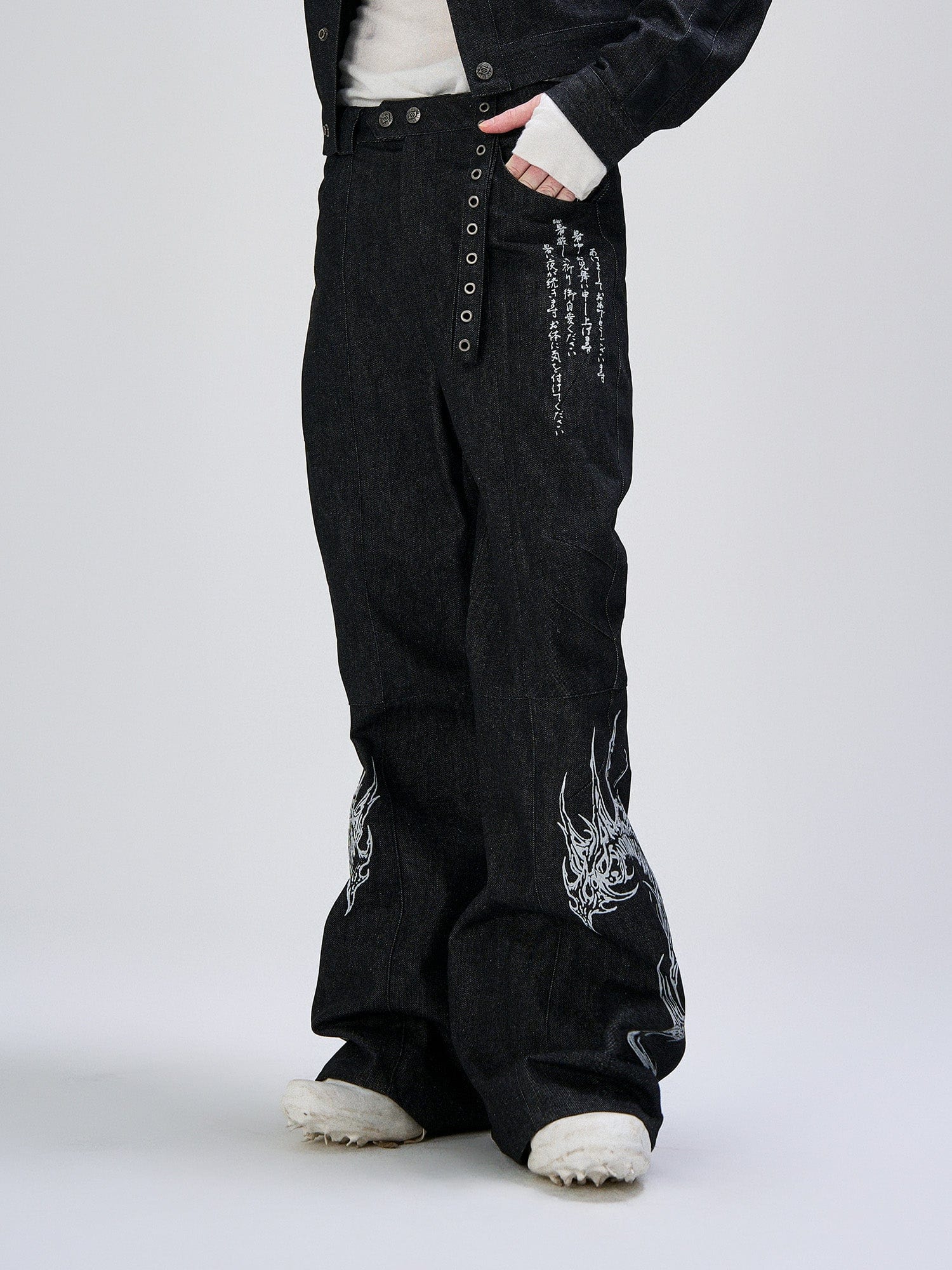 FLYERRER Abstract Graphic Flared Raw Jeans