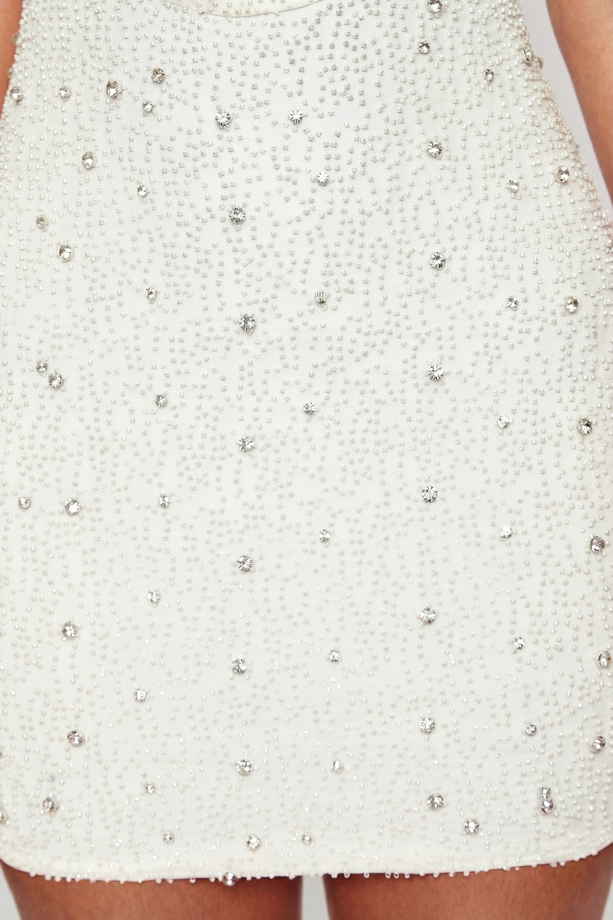 Oh Polly's Priscilla wearing the Versailles Mini Dress in White Embellished fabric perfect for bridal showers